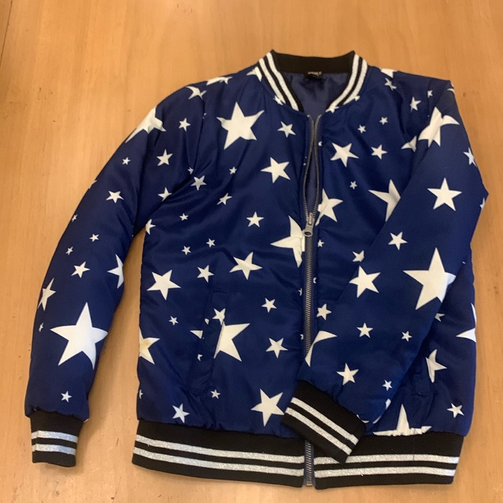 Blue and white star bomber jacket. Silver detailing.